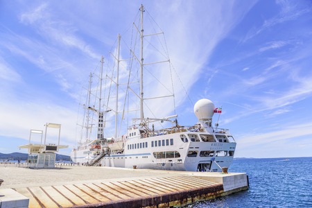 A large cruise sailing ship in the port on the embankment of the city of Zadar.のeditorial素材
