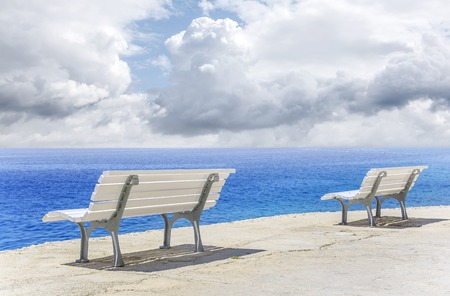 White bench on the waterfront.の写真素材