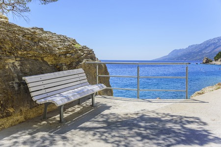 White bench on the waterfront.の写真素材