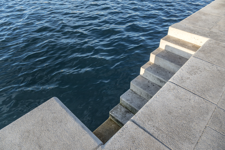 Descent to the water on the seaside promenade.の写真素材