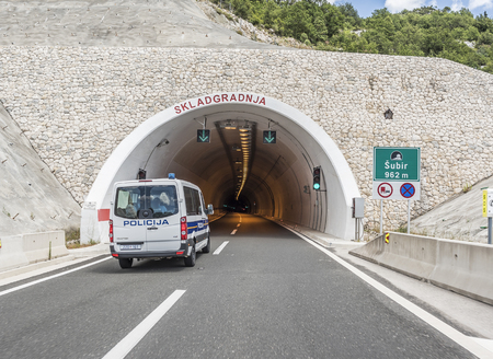 MAKARSKA, CROATIA - JULY 16, 2017: Tunnel on the highway and police patrol car.のeditorial素材