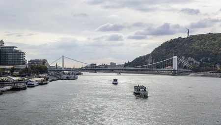 BUDAPEST, HUNGARY - OCTOBER 28, 2017: Cruise ship and panoramic view of Danube in Budapestのeditorial素材