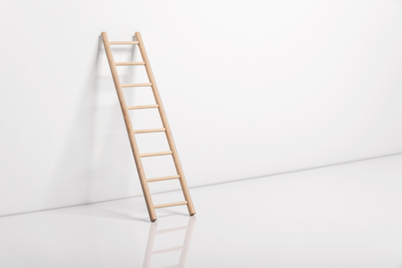 Wooden ladder leaning against the wall.の写真素材