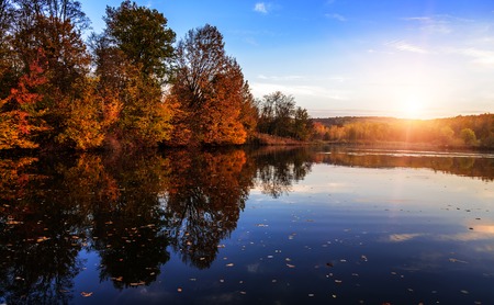 Autumn landscape with lake in the forest. Autumn forest.の写真素材