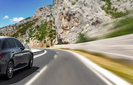 Car rushing along a high-speed highway.の写真素材
