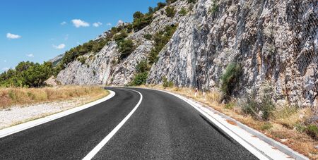 Mountain highway with blue sky.の写真素材