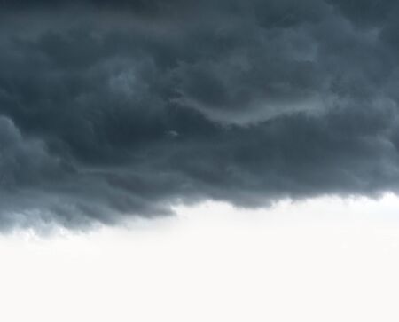 Thunderstorm clouds covering a clear sky.の写真素材