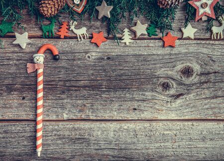 Festive objects of New Year and Christmas on a wooden background.の写真素材