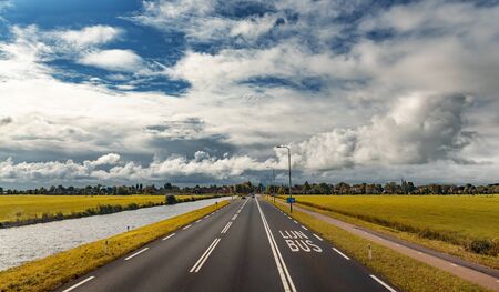 Asphalt road on a cloudy day.の写真素材