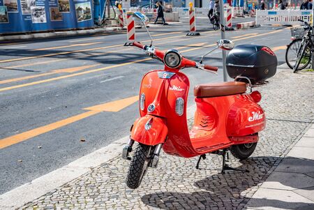 Red scooter on a city streetのeditorial素材