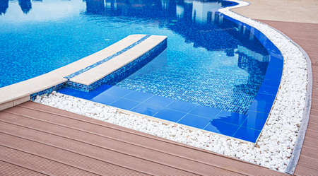 Elements of a swimming pool. Beautiful swimming pool with blue tiles closeup.の写真素材