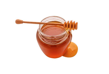 Jar with honey isolated on white backgroundの写真素材