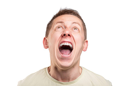 Funny young guy portrait isolated on a white background.