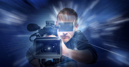 Operator with a camera on an abstract technological background. Digital video technologies