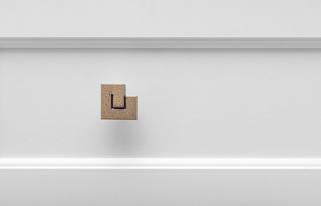 Decorative handle on a white chest of drawers