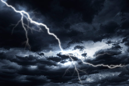 Lightning strike against the background of a cloudy sky.