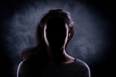 Female silhouette against a dark background