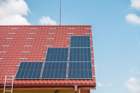 Solar panel power plant on the roof of house.