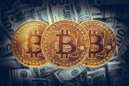 Bitcoin coin on the background of dollar bills.