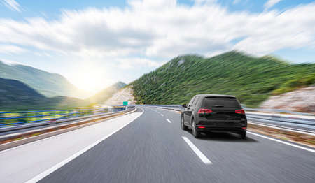 Beautiful young woman driving a car.の写真素材