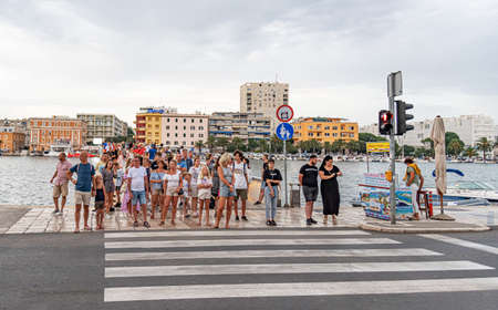 People at the crosswalk in the old town, in Zadar, Dalmatia, Croatia.のeditorial素材
