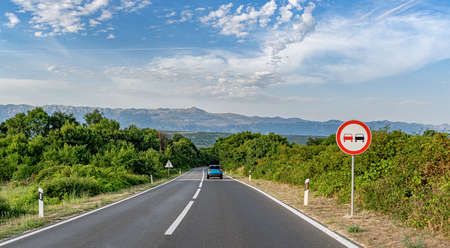 Scenic road. Road is surrounded by a magnificent natural landscape.の写真素材