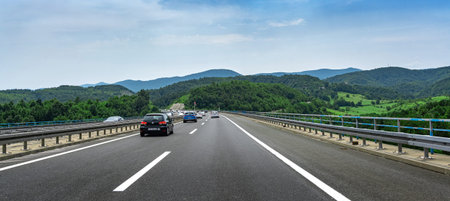 Cars are driving on the expressway or autobahn.