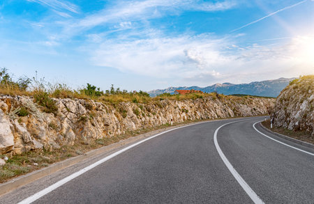 Scenic road. Road is surrounded by a magnificent natural landscape.
