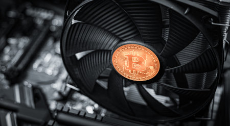Cryptocurrency mining. Bitcoin coin on a graphic card, video card for cryptocurrency mining....