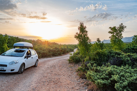 Travelers white car Fiat on the Zrmanja canyon at sunset. Croatia.のeditorial素材