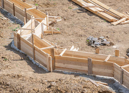 Wooden formwork for pouring concrete foundation of the house.の写真素材