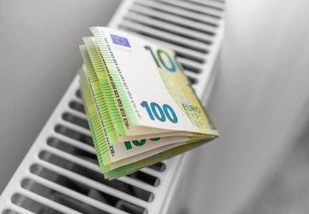 Euro banknotes on a heated radiator.の写真素材