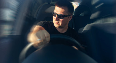The man is driving a car.