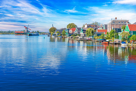 Panorama of traditional dutch houses at the Zaan river in Zaandijk, Netherlands.の写真素材