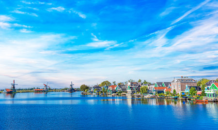 Panorama of traditional dutch houses at the Zaan river in Zaandijk, Netherlands.の写真素材