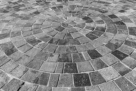 Abstract background of old cobblestone pavement close up.
