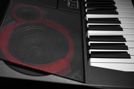 Keyboard synthesizer on a dark background.の写真素材