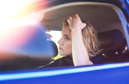 Attractive female driver in the car.
