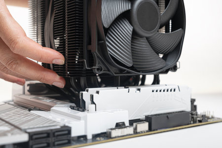 Installing a large cooler on a computer processor.の写真素材