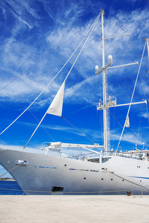 White sailing ship in the port.