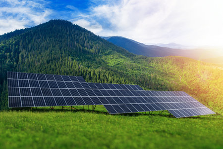 Solar panels of a power plant against a background of nature.
