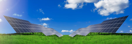 Solar energy panels against sky with clouds
