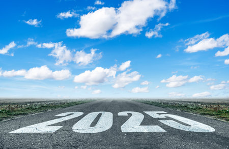 Asphalt road with the number 2025.の写真素材