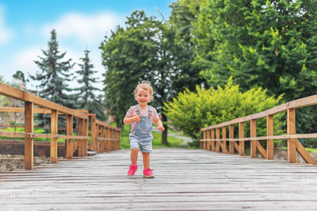 A small child on a bridge.の写真素材