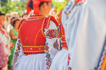 Colorful traditional Eastern European folk costumes with intricate embroidery