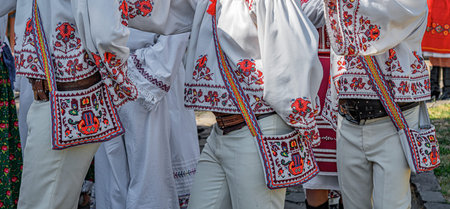 Colorful traditional Eastern European folk costumes with intricate embroidery