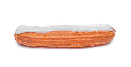 An isolated, perfectly baked eclair pastry with a light brown choux dough shell is topped with smooth, white sugar glazeの写真素材