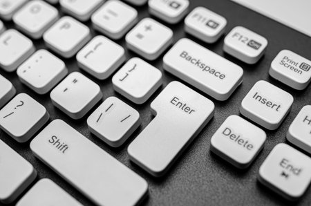 The Enter key and surrounding white keys of a modern computer keyboard.