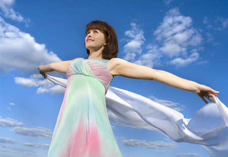  beautiful girl over sky background の写真素材