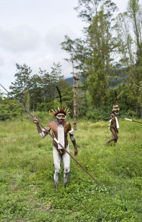 NEW GUINEA, INDONESIA -DECEMBER 28: Unidentified warriors of a Papuan tribe in traditional clothes and coloring in New Guinea Island, Indonesia on December 28, 2010 のeditorial素材